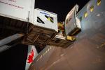 Air Canada Cargo entering Air Canada plane