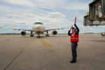 Employee guiding in Air Canada plane